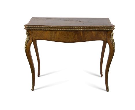 A FRENCH WALNUT, MARQUETRY AND ORMOLU MOUNTED CARD TABLE, the fold-over top enclosing a baize lined interior above a conceale