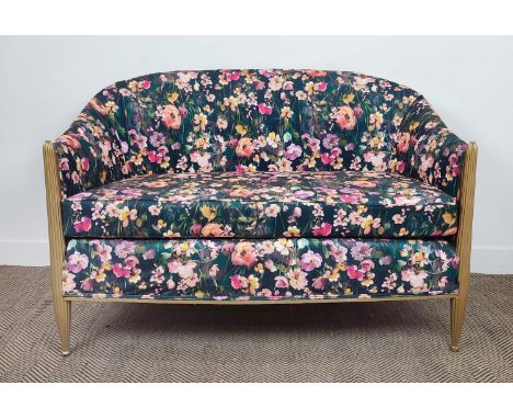 ART DECO STYLE SOFA, in floral velvet upholstery, on gold painted reeded supports, 90cm H x 135cm W x74cm D.