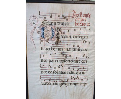 A large vellum manuscript leaf of music and chant, probably from an antiphoner, in colours, with an illuminated capital 'D', 