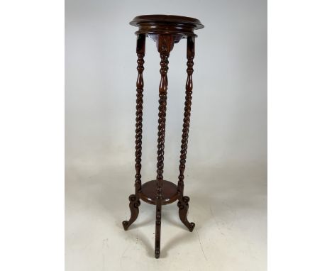 A 20th century mahogany barley twist plant stand with lower shelf. H:99cm