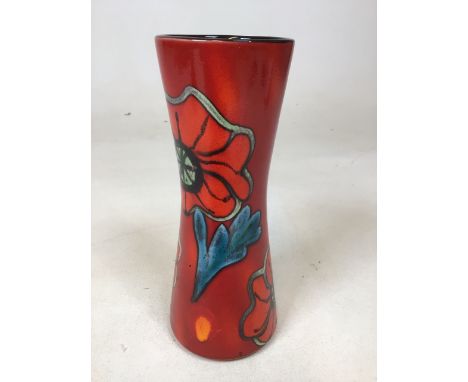 A Poole pottery vase designed by Andrew Tanner in red and orange with floral design W:10cm x H:24cm