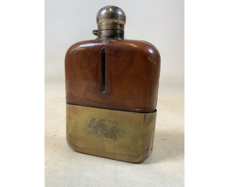 A vintage silver plate and leather hip flask with slide off silver plate cover. H:17cm