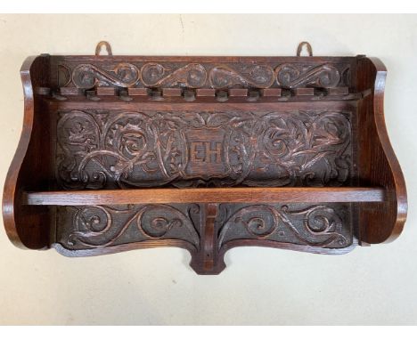 A late Victorian carved pipe rack.W:43cm x H:30cm