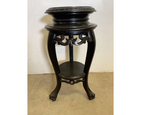 A Chinese ebonised circular plant stand with lower shelf. W:40cm x D:40cm x H:80cm
