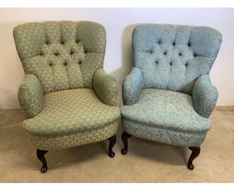 A pair of upholstered button back arm chairs with different upholstery.H:45cm