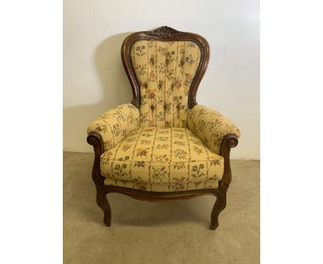 An upholstered open arm button back chair. W:75cm x D:80cm x H:103cm