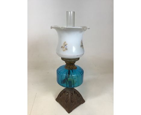 A vintage Duplex  lamp with a cast iron base and floral decorated shadeW:20cm x H:58cm