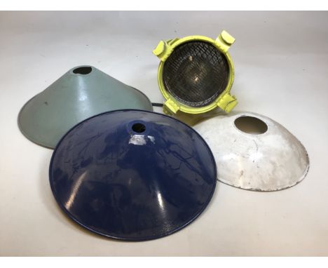 An industrial work light together with three vintage metal/enamel lamp shades 