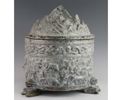 * A Chinese green glazed pottery incense burner (Boshan Lu), the cover modelled as a mountainous landscape, the cylindrical b
