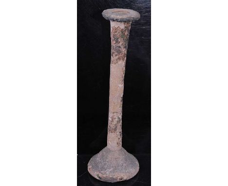 An Egyptian / Roman tall candlestick unguentarium glass vessel, having a flared circular rim to a slender neck and domed base