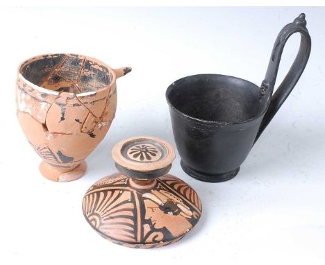 * A terracotta skyphos, having black painted decoration, Greece, 4th century B.C.E., h.10cm, together with a terracotta jar c