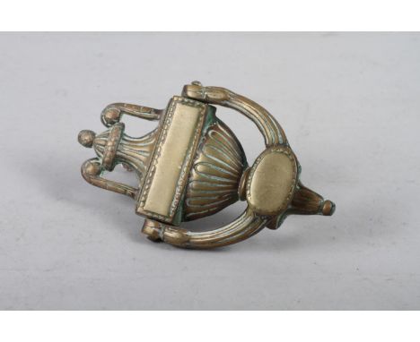 A brass door knocker of Neoclassical design 