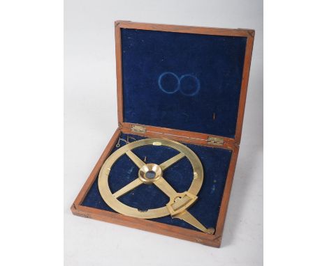 A Stanley engraved brass circular protractor with vernier and arm, in fitted mahogany case 