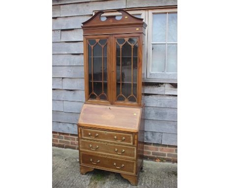 An Edwardian Sheraton design bureau bookcase, fitted three drawers, 30" wide, a mahogany framed firescreen inset floral embro