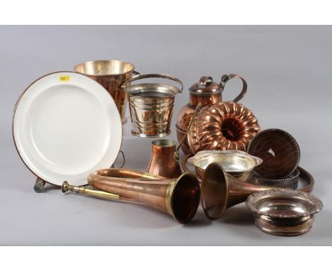 An assortment of metalware, including a pair of silver plated wine bottle coasters, a copper jersey jug, 7 3/4" high, a coppe