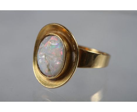 A yellow metal ring, set rough opal, size 5 1/2 