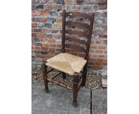 A chestnut ladder back chair with rush envelope seat, a similar beech framed chair, a pair of cane seat bedroom chairs and a 