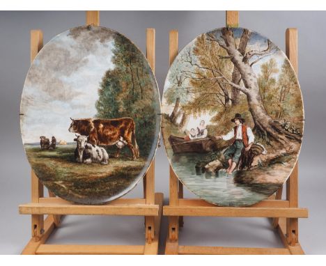 A pair of painted oval porcelain panels, decorated landscapes with cows and figures, 15 3/4" x 12 1/2", two decanters, a wood