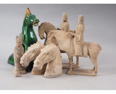 A Chinese green glazed ridge tile, formed as a mythical beast, 11" high, two terracotta horse heads, 5 1/2" high, two terraco