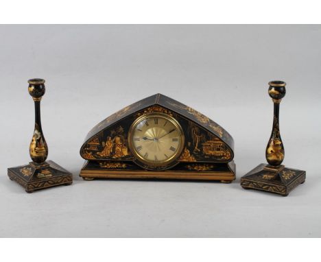 An early 20th century arch top mantel clock, in black and gilt chinoiserie decorated case, 6 high, and a pair of matching can
