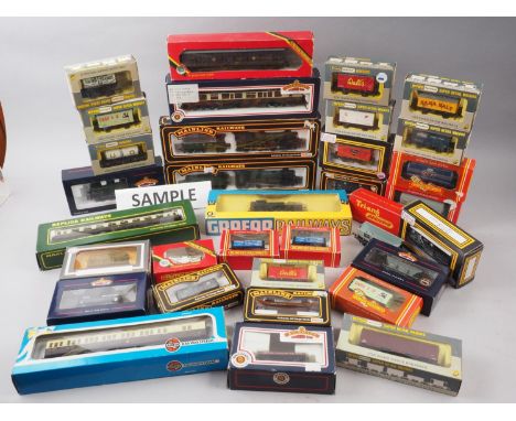A quantity of boxed locomotives and carriages, including Palitoy 00 Gauge locomotive and carriage sets, two Bachmann 00 Gauge