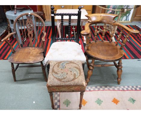 A 20th century elm wheel back armchair, horseshoe back armchair, ebonised bobbin chair and a tapestry upholstered stool (4)&n