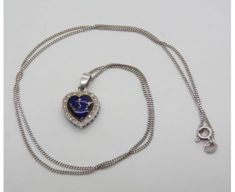 An 18ct yellow and white gold blue enamel and clear gem set heart pendant, with a 50cm 18ct white gold chain, weight together