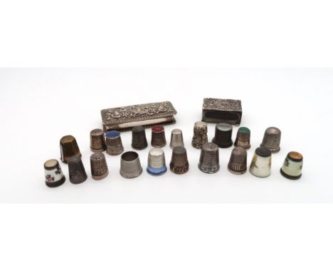 A collection of silver and white metal thimbles, including guilloche enamel continental examples, decorated with flowers and 