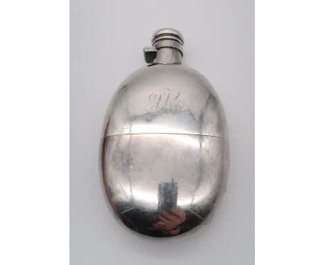 A late Victorian silver hip flask, by Sampson Mordan &amp; Co, London 1892, of oval form, engraved monogram, 180gms Condition