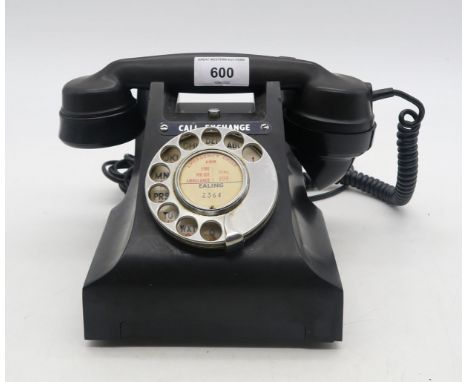 A Bakelite rotary dial telephone, numbered "Ealing 2364" Condition Report:Available upon request