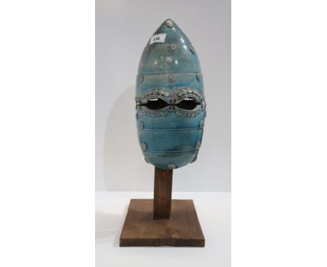 A contemporary ceramic sculpture of a antique warriors helmet Condition Report:Available upon request
