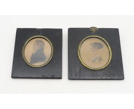 A pair of early-19th century profile portrait miniatures in ebonised frames, identified verso as John Mackinlay of Achley, Do