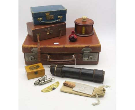 A small leather suitcase, containing Mauchline ware box (Trongate, Glasgow), miniature Royal Doulton Flambe vase, gaming toke