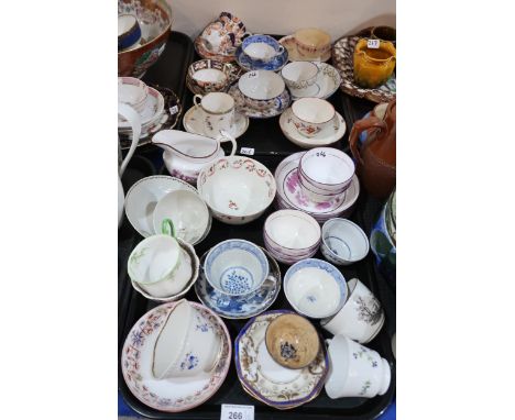 A collection of Chinese and English porcelain including a blue and white tea cup decorated with vignettes of scholars and flo