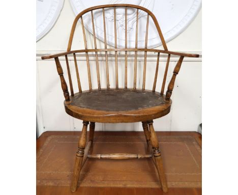 A 19th century elm stick back Windsor armchair with double back over shaped seat on turned stretchered supports, 92cm high x 