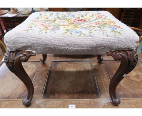 A Victorian oak framed stool with floral tapestry upholstered seat on cabriole supports, 44cm high x 56cm wide x 46cm deep Co