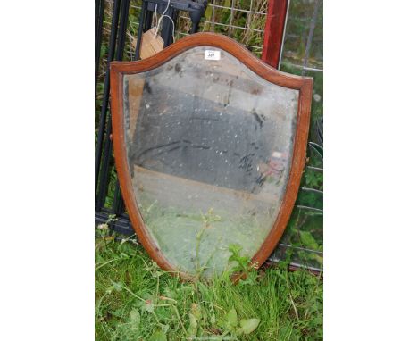 A shield shape bevelled mirror.