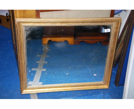 A gilt framed mirror. 