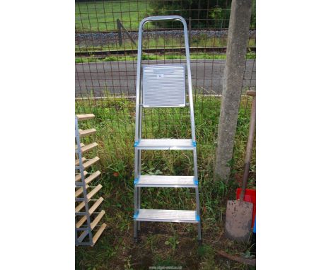 An Aluminum four rung step ladder.