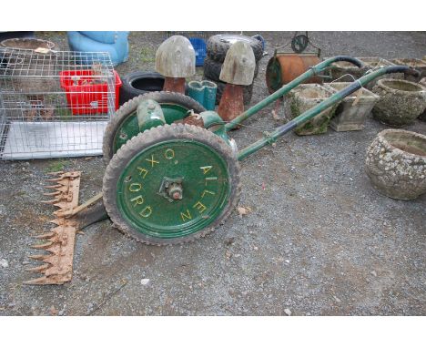 An 'Allan Oxford' mower, engine turns. 