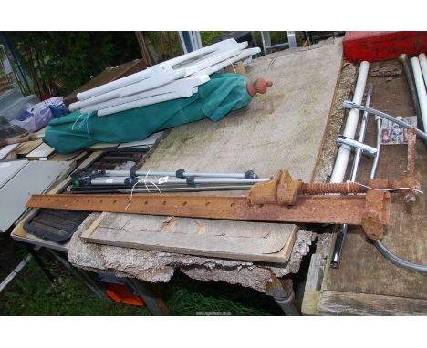 A tripod stand and large sash clamp.