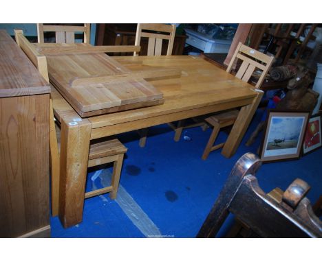 A light oak Dining table - 71" long x 35" wide x 29½" high with two extension leaves, 20'' each