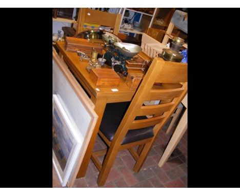 A light oak square dining table with two chairs 