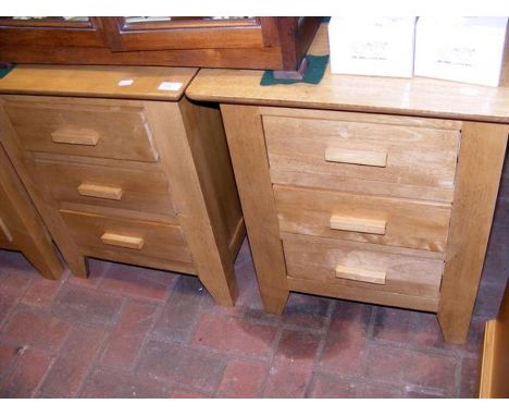 A pair of light oak bedside cabinets - width 54cm 