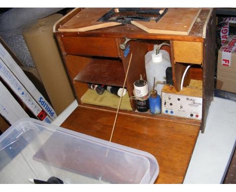 A flight box with electric starter, fuelling system, glow plug power and box with props, tanks, spinners, wheels, leads and m