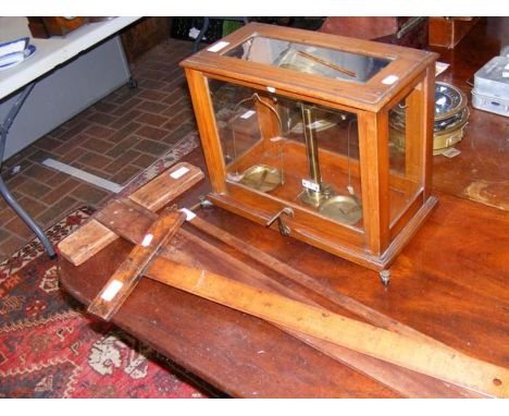 A set of Baird and Tatlock laboratory scales together with vintage T square rulers and a lambing stick