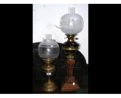 A decorative oil lamp and one other 