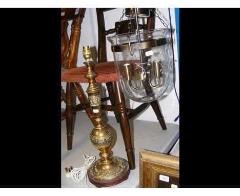 A small porch light with floral detail to glass, together with a brass table lamp 