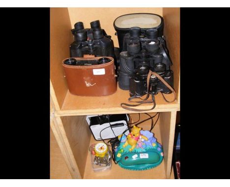 A collection of vintage binoculars, including Magnivu 8 x 30, together with a Polaroid radio and Winnie The Pooh telephone, e