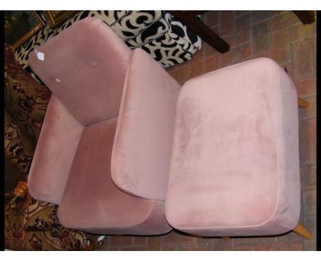 A contemporary MADE.COM 'Elvi Accent' armchair and matching footstool in vintage pink velvet